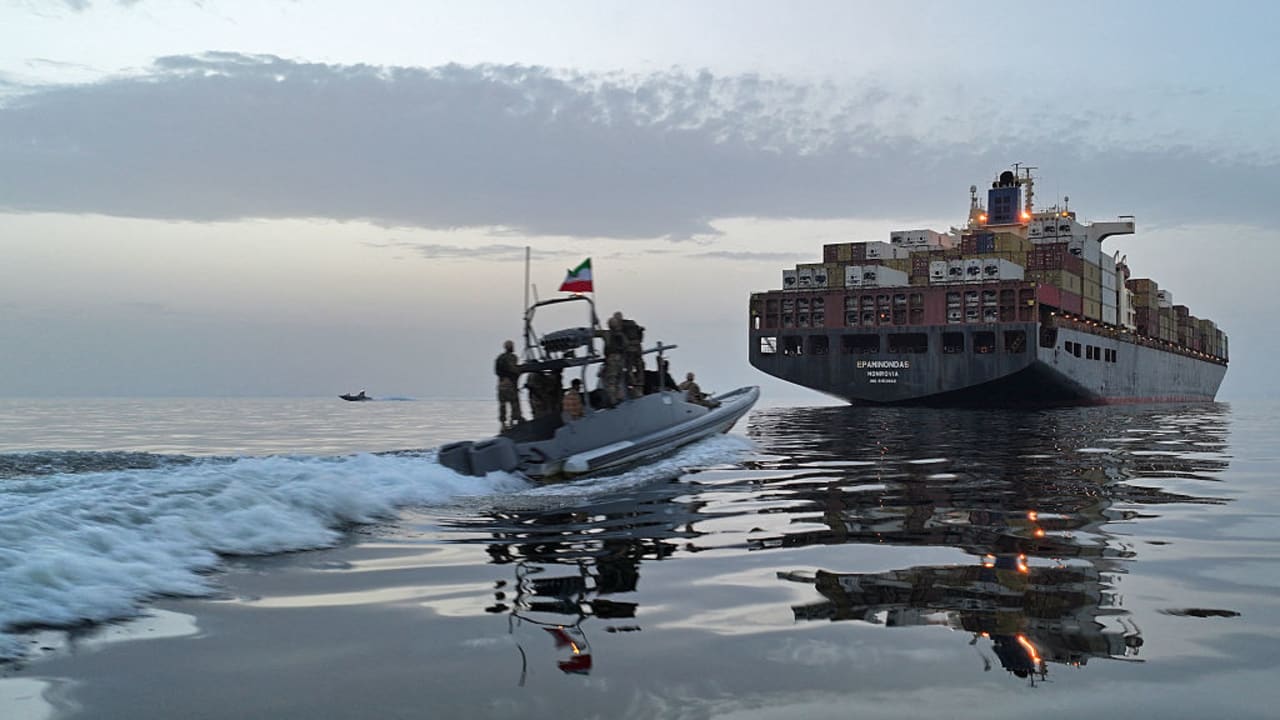 This photo obtained by AFP from the Iranian news agency Tasnim shows an Islamic Revolutionary Guard Corps (IRGC) boat allegedly taking part in an operation to seize ships attempting to cross the Strait of Hormuz, on April 21, 2026.