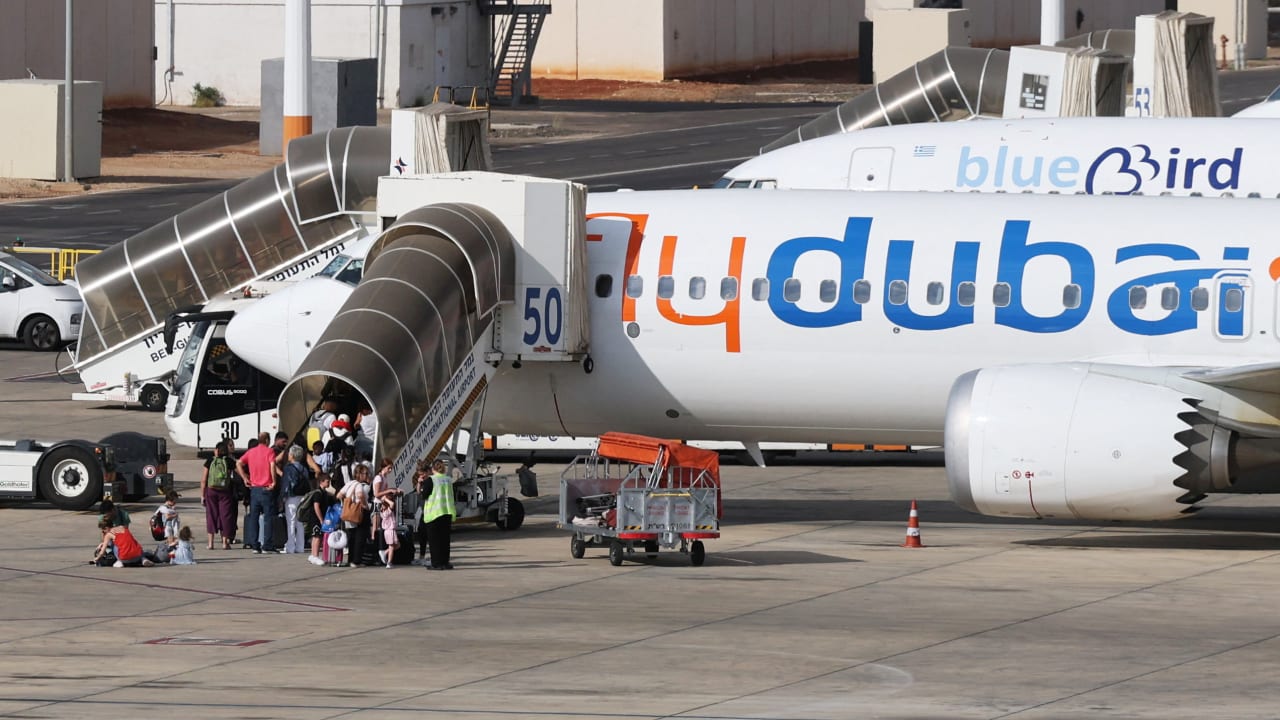 Travelers board a FlyDubai aircraft at Ben Gurion International Airport after a separate FlyDubai flight from the United Arab Emirates to Israel was diverted to Saudi Arabia following an emergency signal, in Lod, near Tel Aviv, Israel, September 30, 2026.