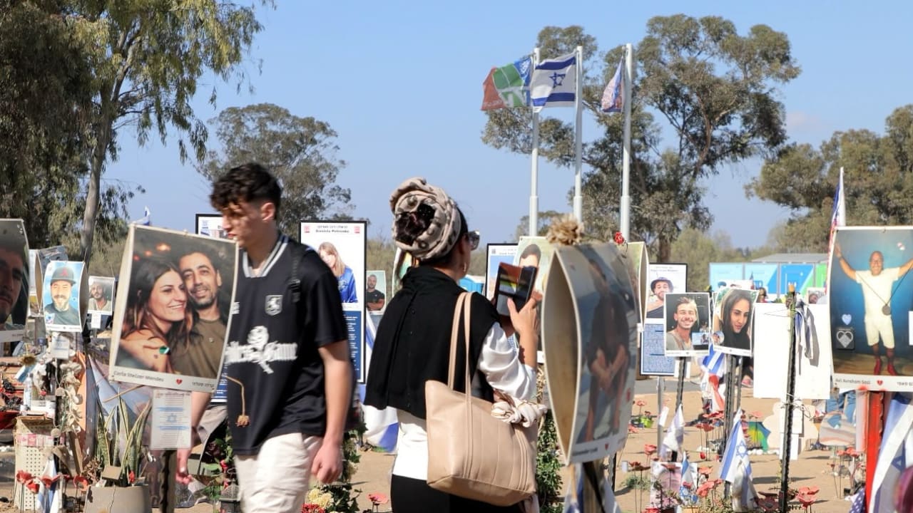 Visitors to the site of the Nova music festival.