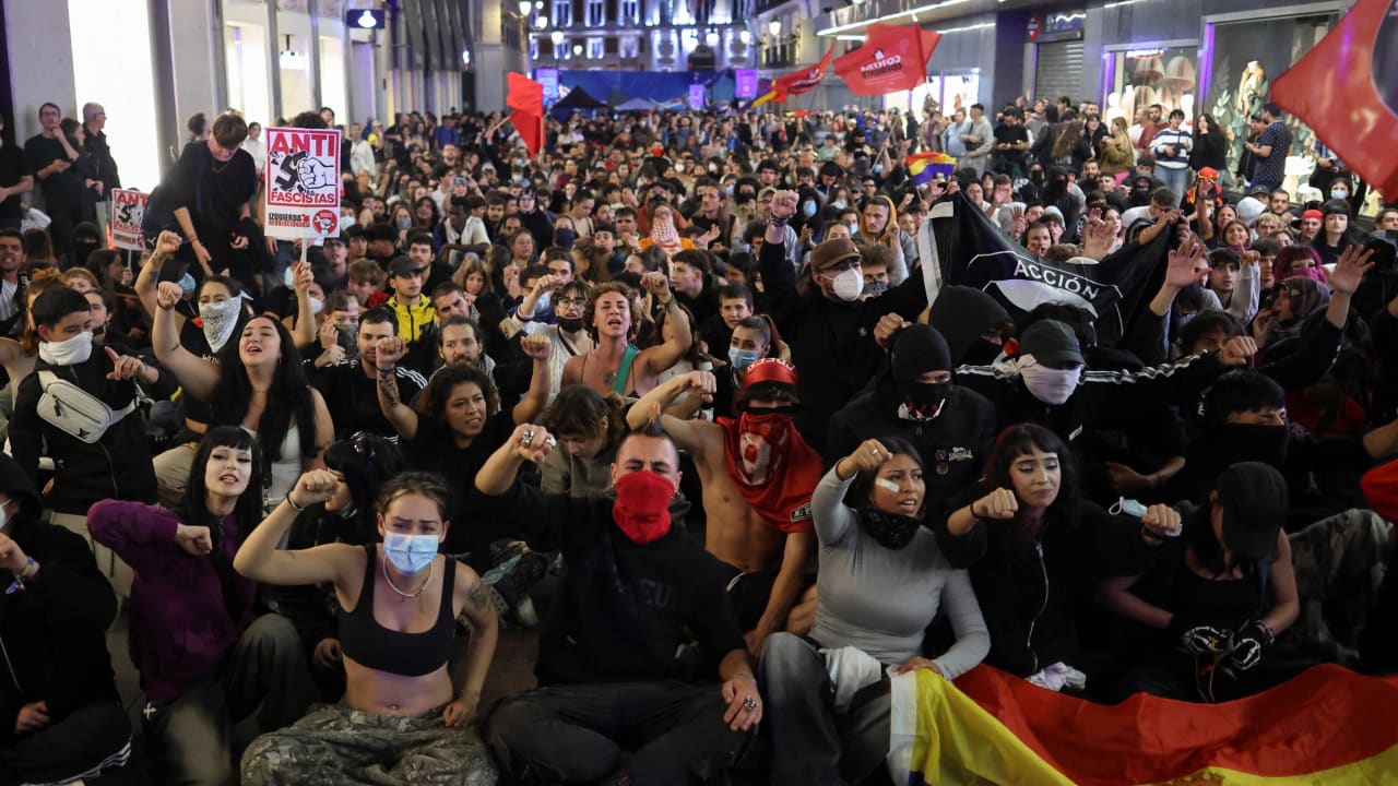 People take part in a protest against fascism and the housing crisis in Puerta del Sol square, where a camp has been set up, demanding political action to stop evictions and address the housing crisis, following the eviction of an 87-year-old woman from her home, in Madrid, Spain, October 3, 2026.