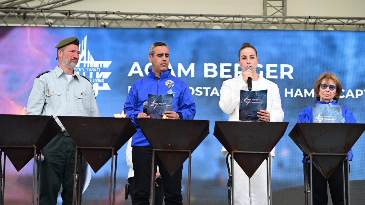(L to R)  Rabbi Shmuel Slotki, father of Noam and Yishai killed fighting Hamas terrorists on October 7 freed hostages Omri Miran and Agam Berger, and Holocaust survivor Irene Shashar at the 2026 March of the Living 