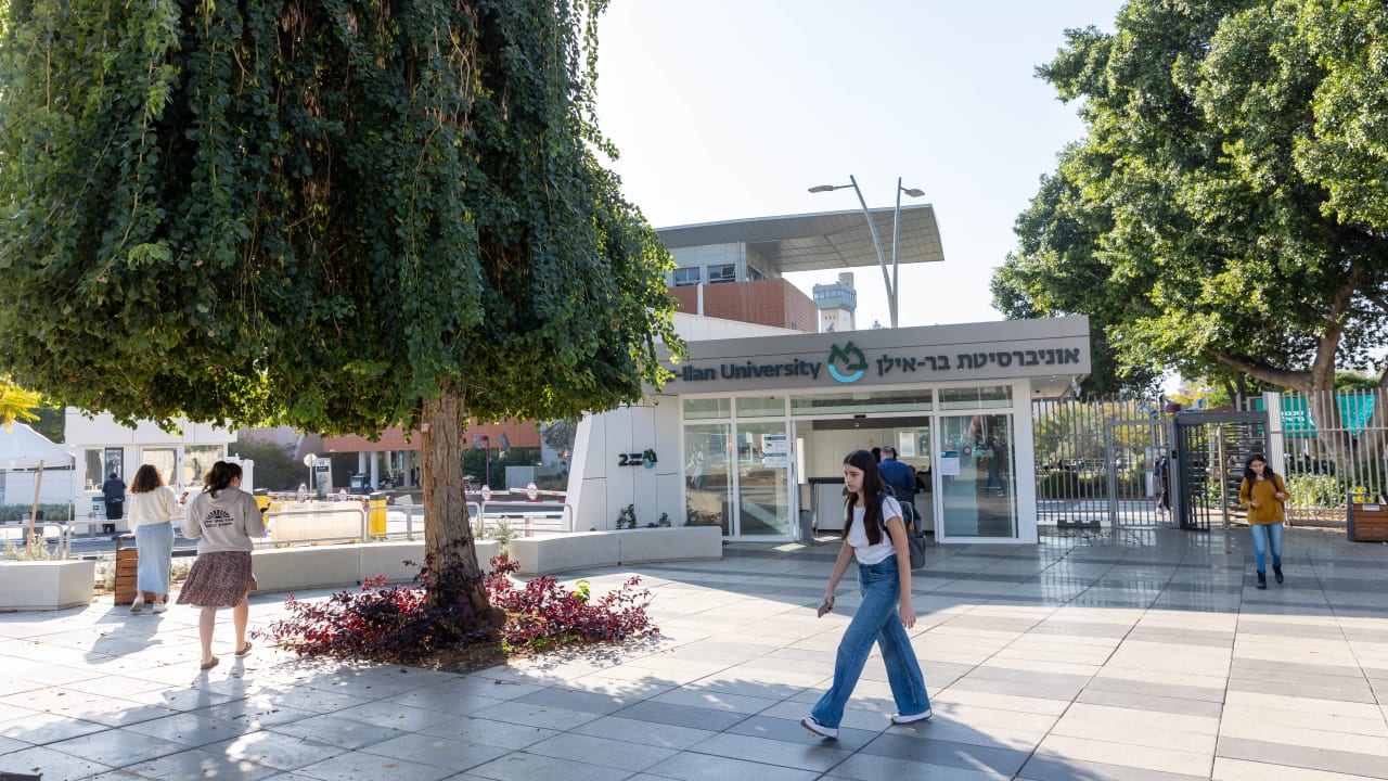 Israeli students walk near the entrance to Bar Ilan University, central Israel, November 21, 2024