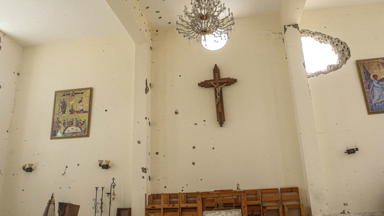 A gaping hole in the wall of a church following Israeli military activity in the southern Lebanese village of Zawtar al-Gharbiyah on August 8, 2026.  