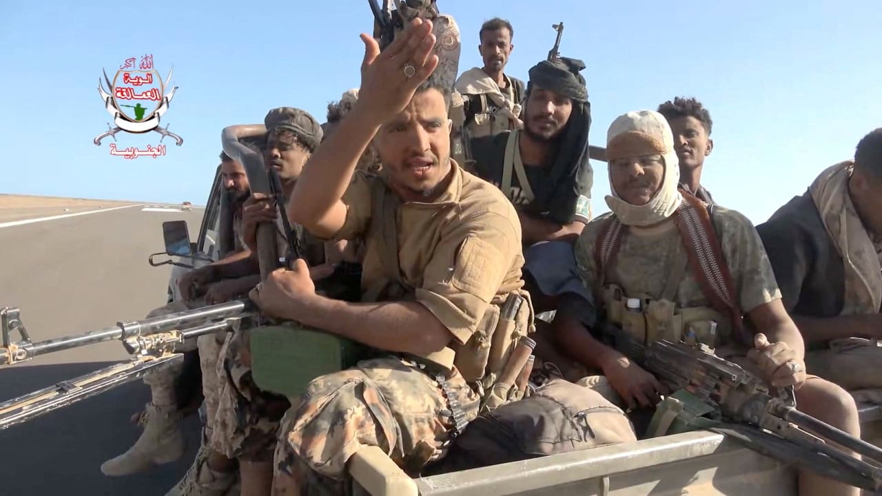 Pro-Saudi-backed Yemeni government fighters sit in the back of a vehicle during what government forces say was an advance against the Iran-backed Houthis, near Dhubab, Taiz Governorate, Yemen, in this still image taken from video released October 5, 2026. 