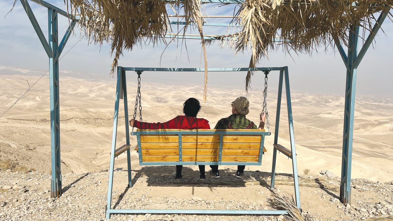 ISI AND TUVIA TENENBOM look out over the Judean Hills. 