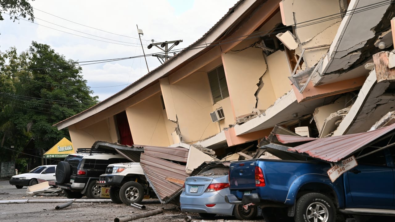This view shows a collapsed building and damaged cars after a 7.6-magnitude earthquake struck the country, in Penonome, Panama, on October 9, 2026. 