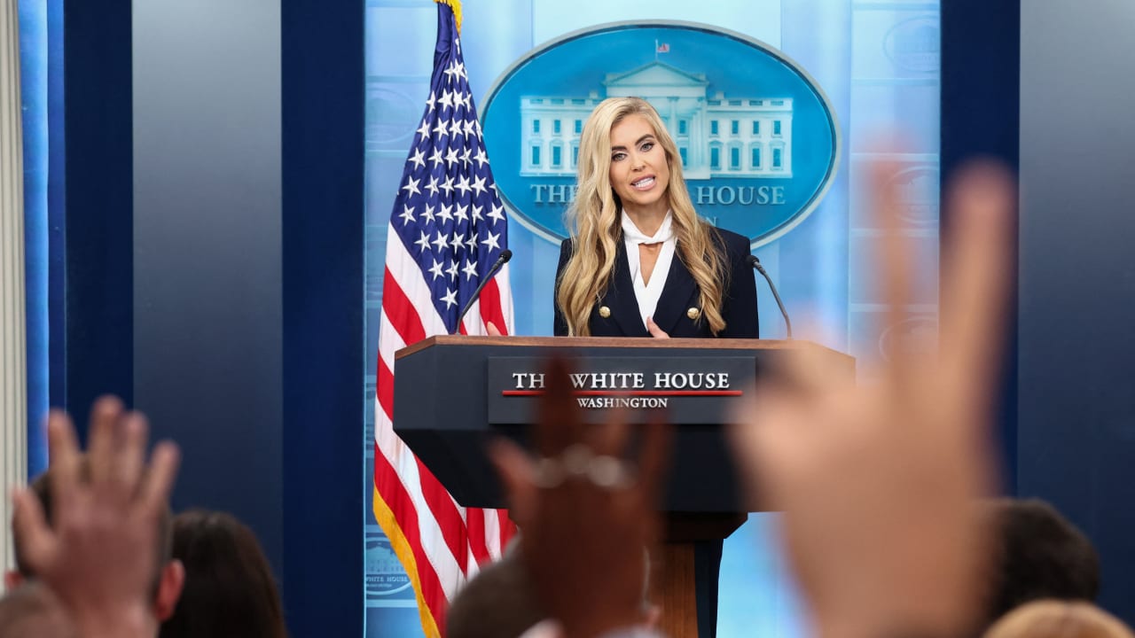 Reporters raise their hands to ask questions as the new White House Press Secretary Katie Zacharia holds her first press briefing at the White House in Washington, DC, US, October 13, 2026.