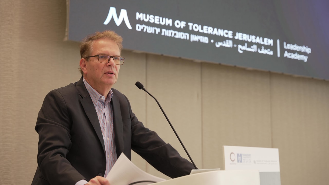 Jonathan Riss, Managing Director of the Museum of Tolerance Jerusalem, welcomes guests to the Forensic Symposium on Tuesday