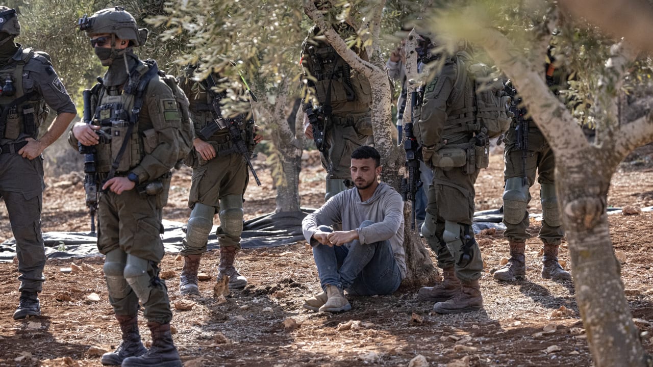 A Palestinian man is detained while attempting to reach his land during the olive harvest on October 17, 2026 in Abu Falah, West Bank. 