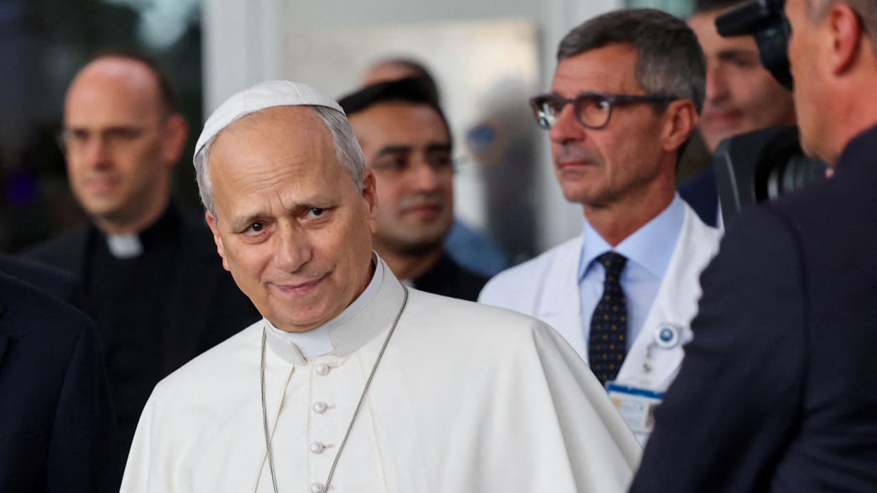 Pope Leo walks ahead of Stefano Margaritora, who was his lead surgeon, as he leaves Gemelli Hospital following his lung surgery and cancer diagnosis, in Rome, Italy, October 17, 2026