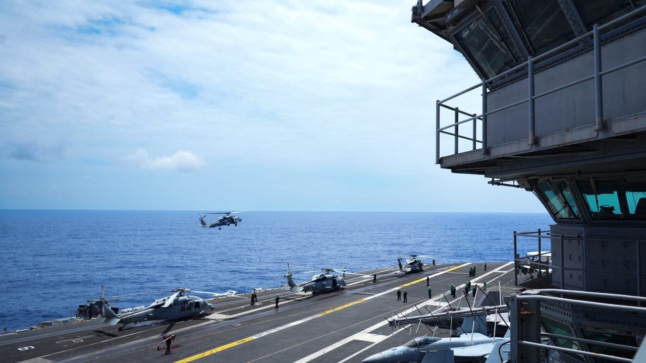 An MH-60 Seahawk helicopter approaches for landing on the aircraft carrier USS Theodore Roosevelt (CVN 71) while underway in the Pacific Ocean near Hawaii, during Exercise RIMPAC (Rim of the Pacific) 2026 on July 17, 2026; illustrative.