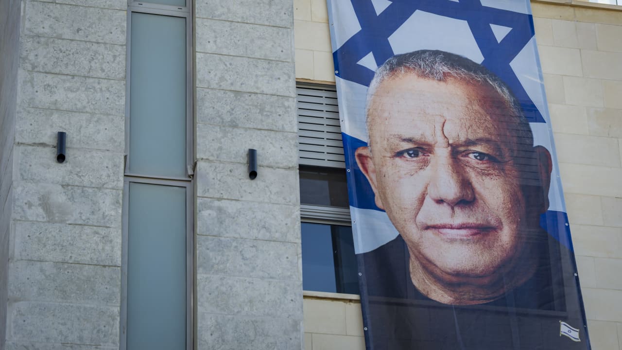 A large election campaign banner featuring Yashar party chairman Gadi Eisenkot is displayed on a building in the northern Israeli city of Haifa, October 18, 2026
