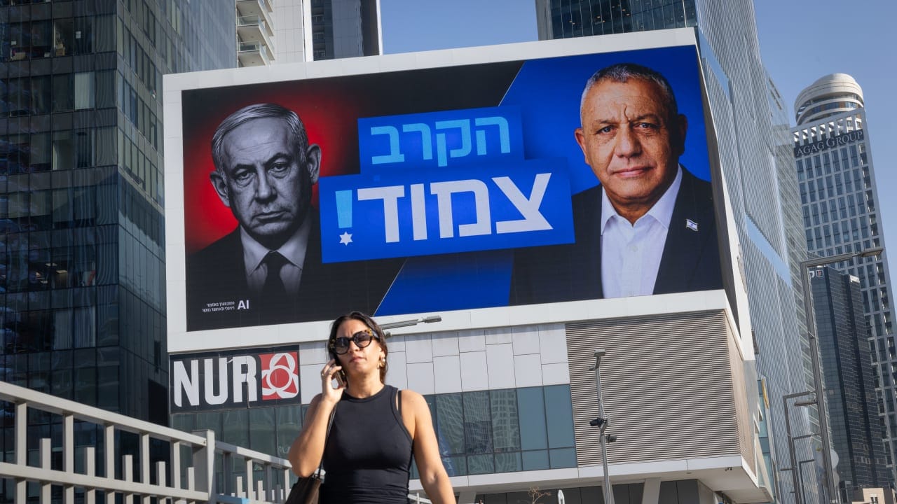 Campaign posters featuring Prime Minister Benjamin Netanyahu and Gadi Eisenkot are seen in Tel Aviv, October 22, 2026