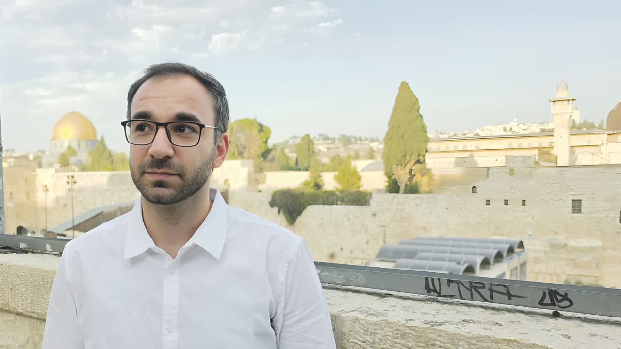 Benjamin Hassin overlooks the Western Wall, just weeks after returning to Israel following more than 11 years in Iraqi prisons, including nearly five years under a death sentence.
