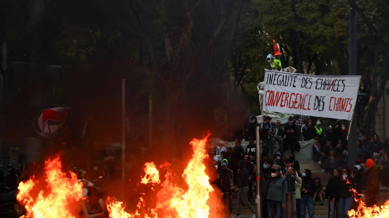 A fire burns next to a sign reading "Inequality of opportunity" during an authorised demonstration organised by a labour union in Marseille, France, October 24, 2026