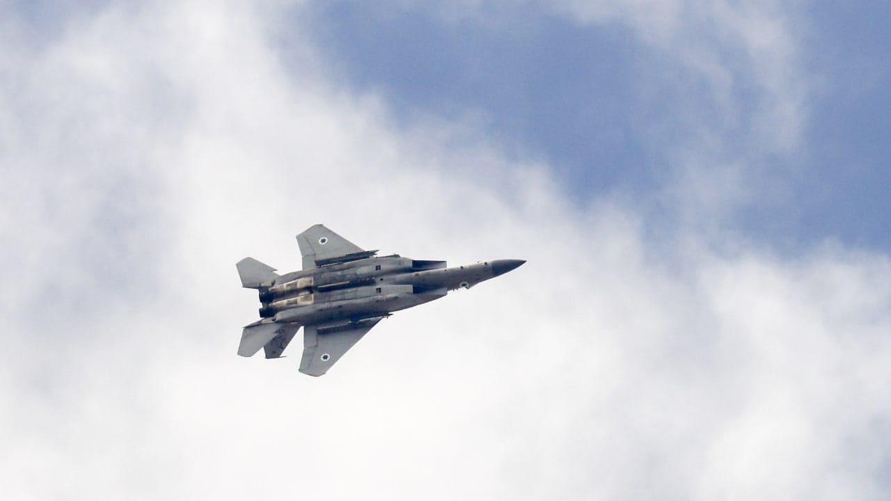 An Israeli fighter jet is seen in the skies over central Israel, October 18, 2026.