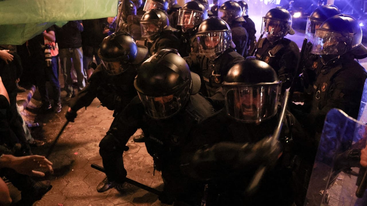 Demonstrators clash with riot police at a protest calling for political action to address Spain's housing crisis in Barcelona, Spain, October 5, 2026.