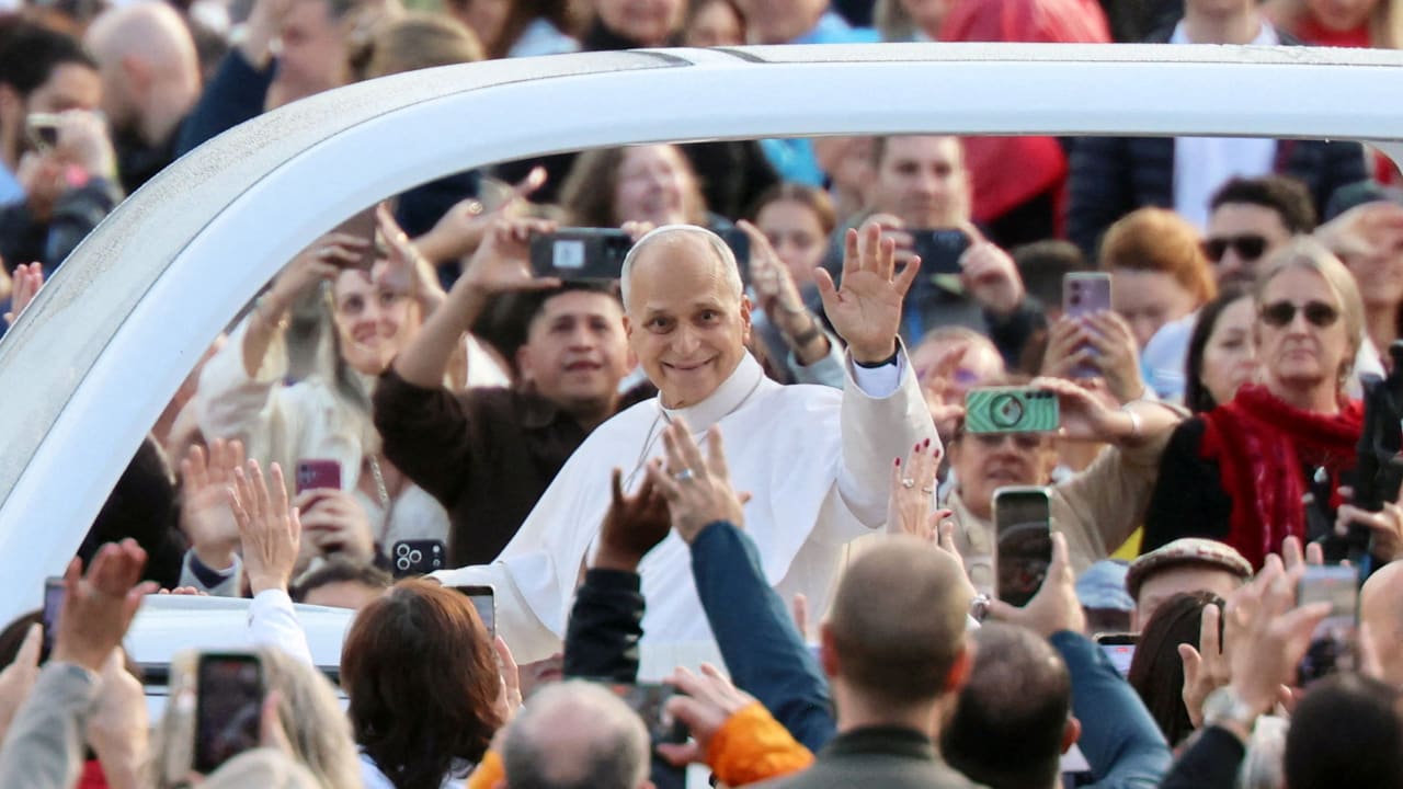 Pope Leo greets faithful as he arrives to hold his first weekly general audience in St. Peter's Square since cancer surgery, at the Vatican, October 21, 2026.