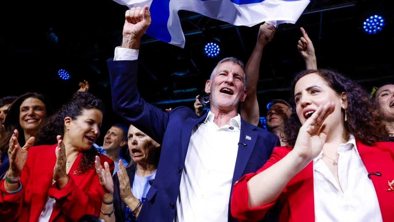 Democrats party chairman Yair Golan and members of his party celebrate at the party’s election headquarters in Tel Aviv, following the release of exit poll results on Israel’s general election night, October 27, 2026. 