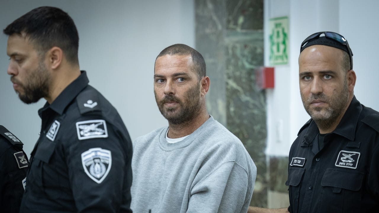 Pinchas Shem Tov Ran, an Israeli civilian security coordinator accused of shooting and seriously wounding a Palestinian woman in the West Bank, arrives at the Jerusalem District Court following his indictment, October 23, 2026. 