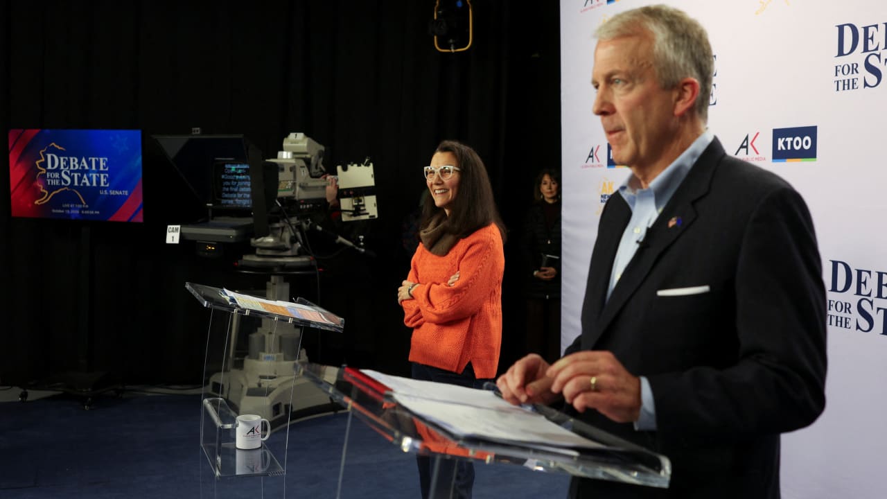 Republican US Senator Dan Sullivan and Democratic US Senate candidate Mary Peltola participate in a debate in Anchorage, Alaska, US, October 15, 2026. 