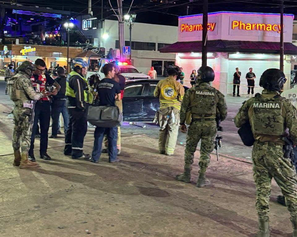 Security personnel and emergency responders stand at the site where a car rammed through a crowd of Mexico soccer fans, in Cabo San Lucas, Mexico, in this handout released on June 25, 2026.  (photo credit: Ayuntamiento de Los Cabos VIA Facebook/Handout via REUTERS)