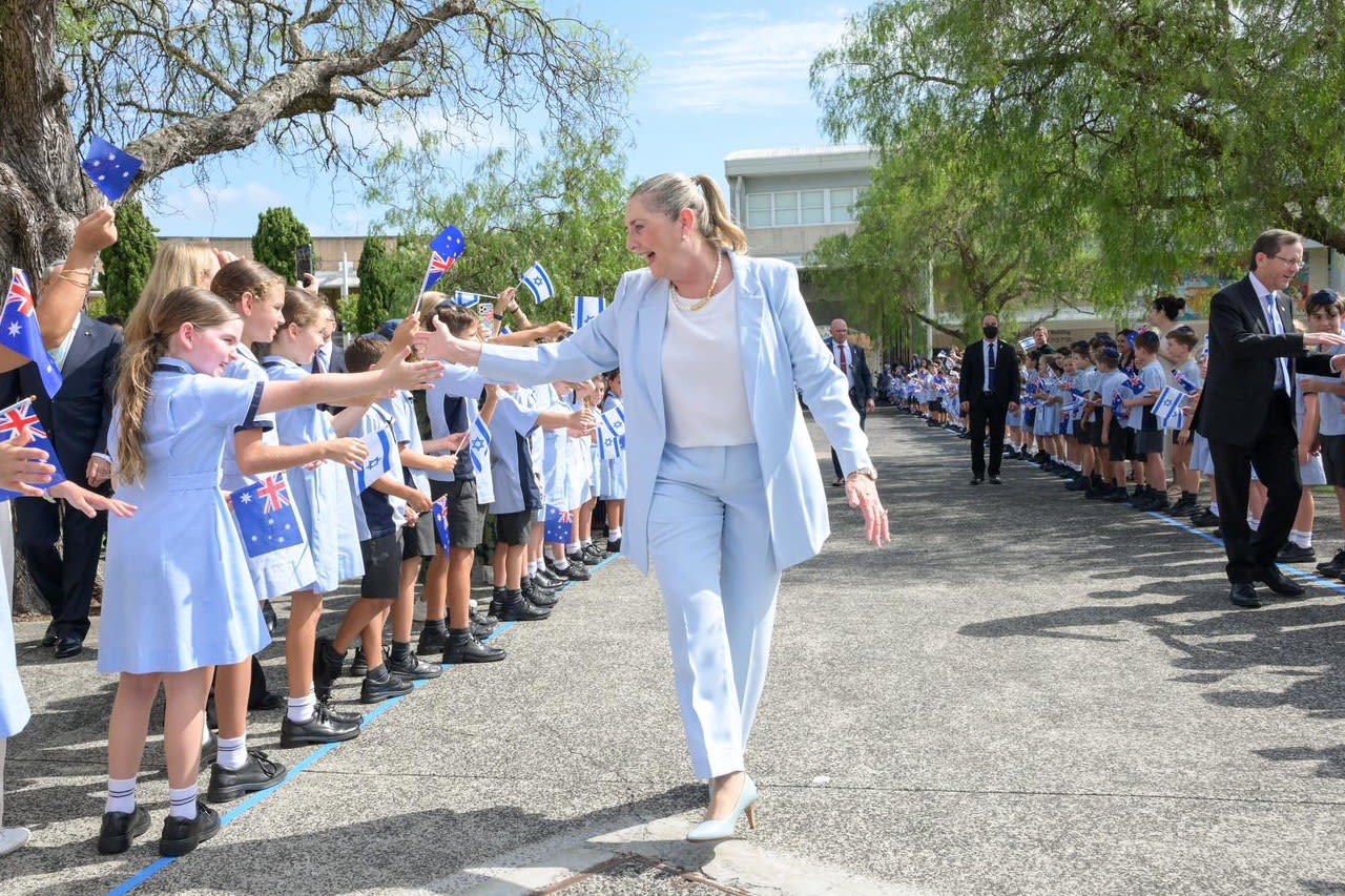 First Lady Michal Herzog, the cover story of this issue, greets schoolchildren during an official visit to Australia. (photo credit: MAAYAN TOAF/GPO)