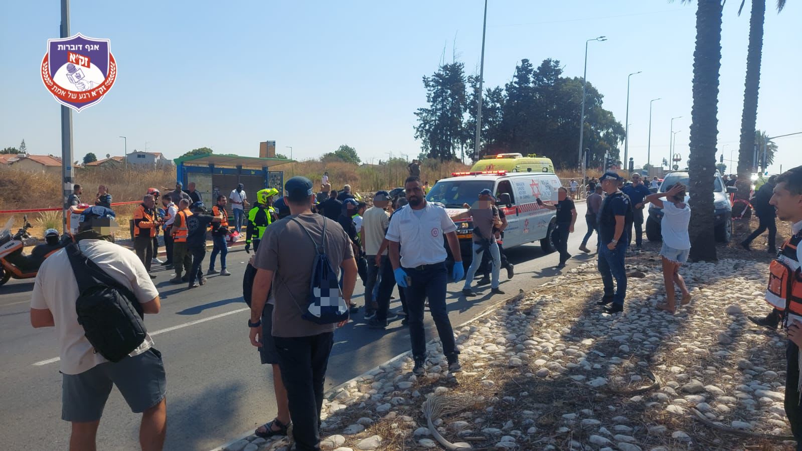 The site of a reported car ramming in Kfar Yona, Magen David Adom and police forces arriving at the scene, July 24, 2025. (photo credit: ZAKA Spokesperson)