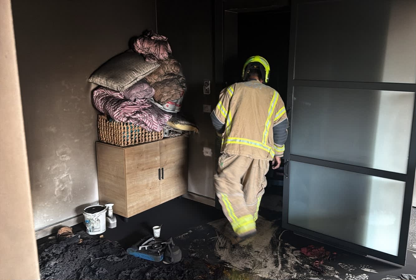 Firefighter at scene of fatal fire in the Golan, October 11, 2026. (photo credit: ISRAEL FIRE AND RESCUE AUTHORITY)