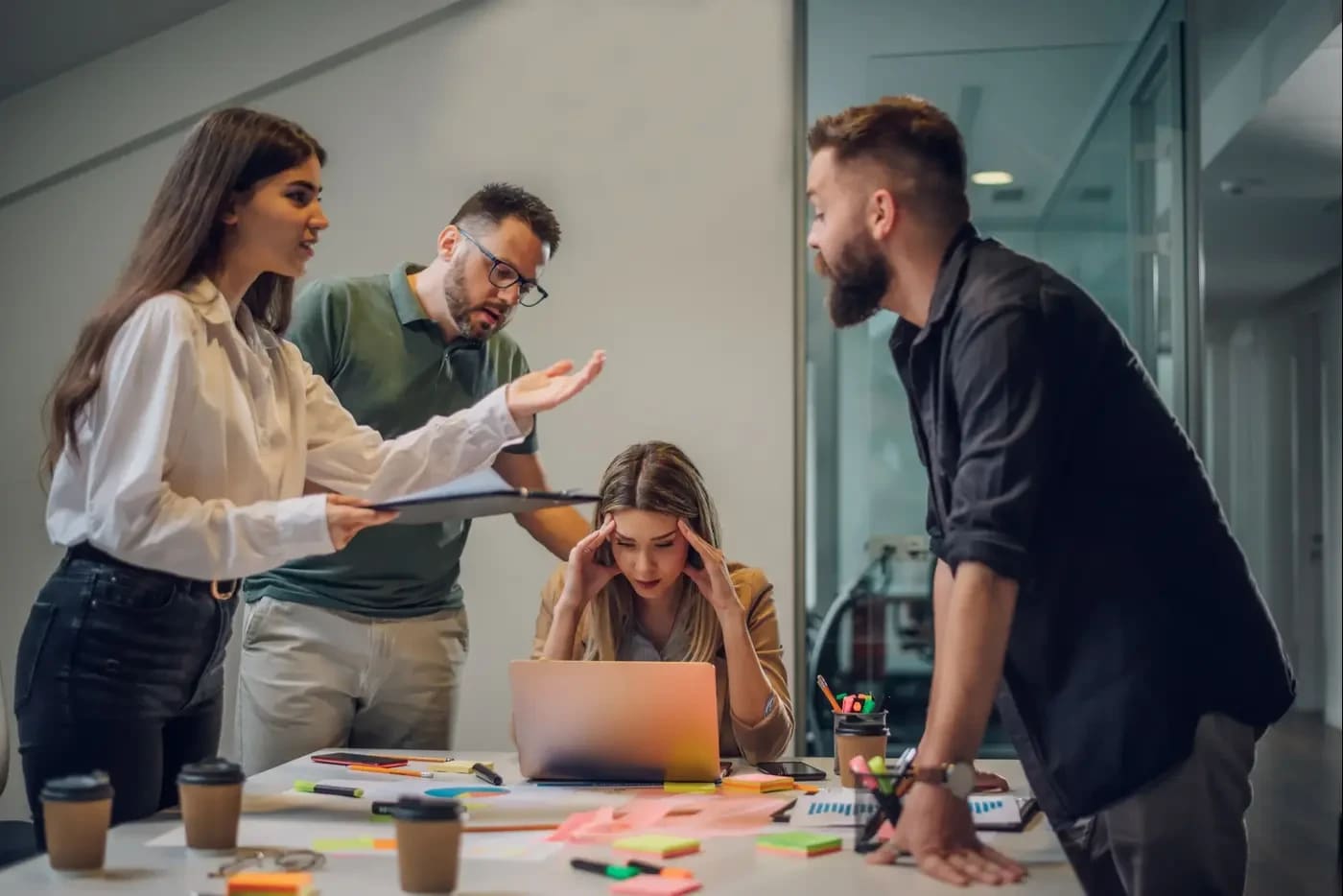 Employees in an office (photo credit: SHUTTERSTOCK)
