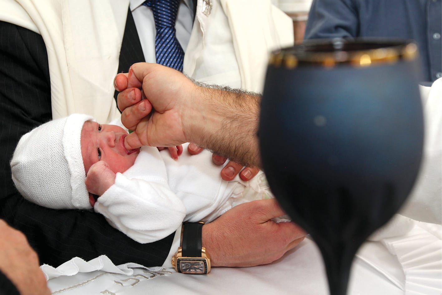  A ‘mohel’ performs a ‘brit milah,’ the Jewish circumcision ceremony, 2012. (photo credit: MARC ISRAEL SELLEM)