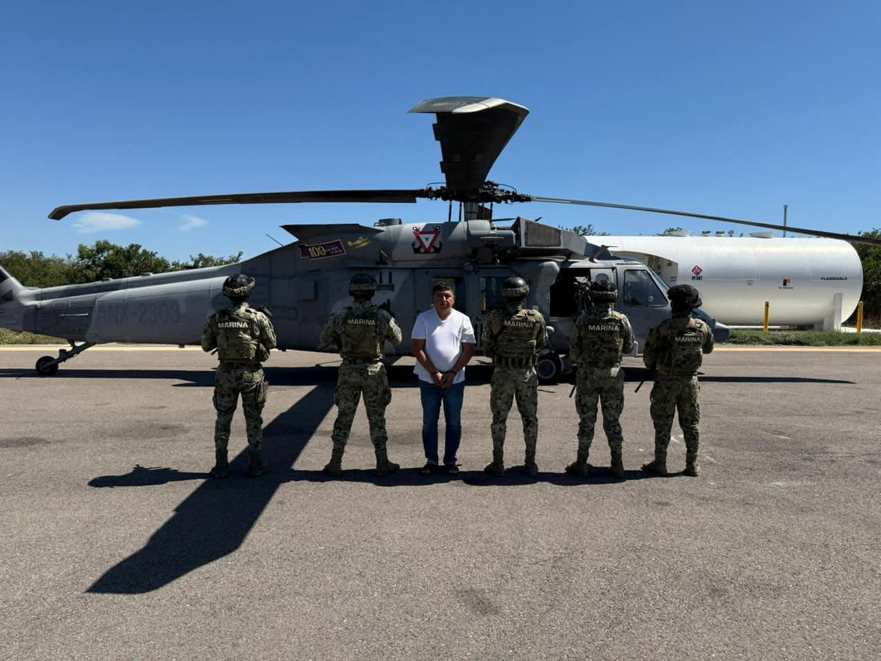 Members of Mexican Special Forces escort Audias Flores, known as “El Jardinero” a top commander of the powerful Jalisco New Generation Cartel, in the western state of Nayarit, Mexico, in this handout distributed on April 27, 2026.  (photo credit: Secretaria de Marina (SEMAR)/Handout via REUTERS)