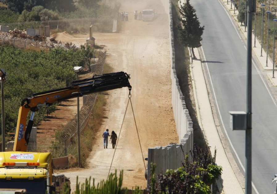 A wall on the Israeli side of the Lebanese-Israeli border under construction (credit: Reuters)