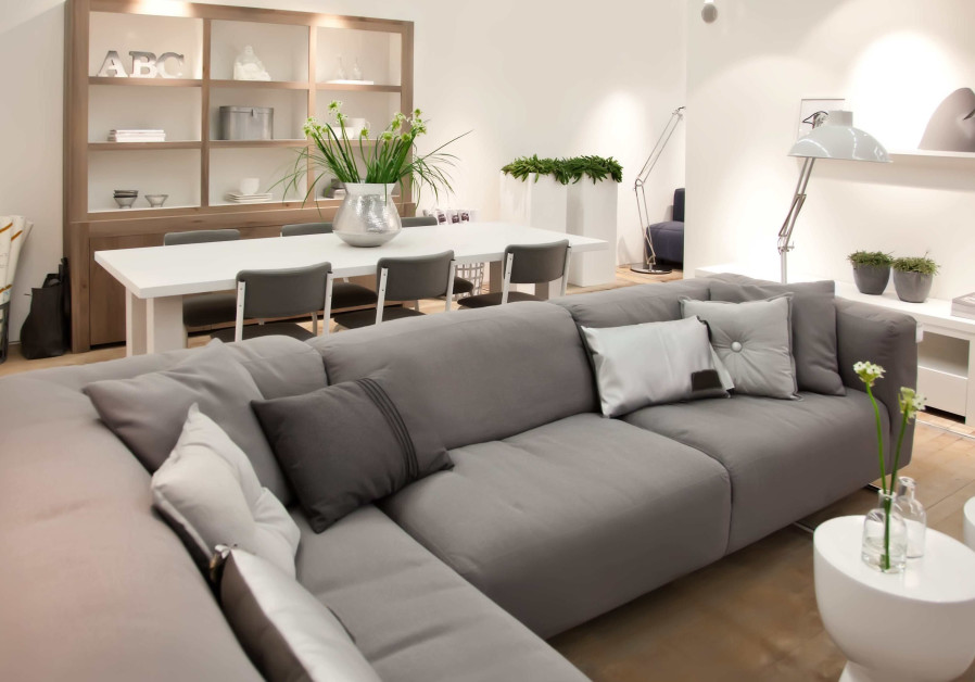 Consider placing the sofa set in the corner of the room to preserve space and emphasize the room's fresh look