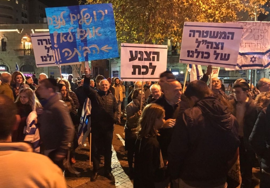 Anti-Corruption protest, man holds a blue sign that says: "Jerusalem is eternal, you are not, go home!"  / UDI SHAHAM 