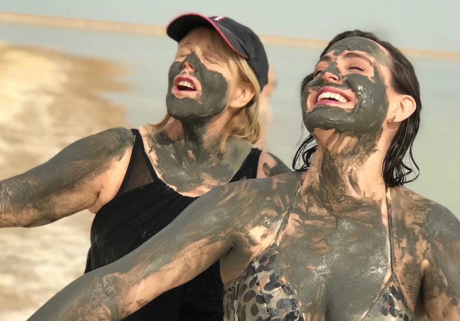 Kim Friedman and Kate Siegel covered in the incredibly healthy Dead Sea mud.