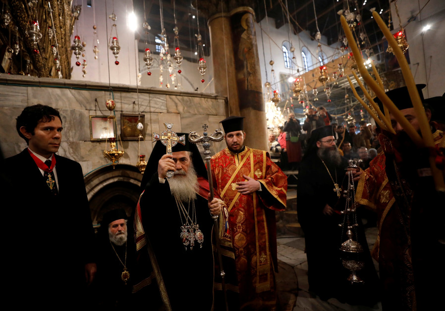 The Greek Orthodox Patriarch of Jerusalem Theophilos III attends a Christmas service according to the Eastern Orthodox calendar, in the church of Nativity in the West Bank city of Bethlehem.
