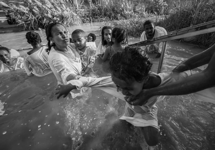 Qasr el Yahud baptism with child  / LIMOR BAHAR 