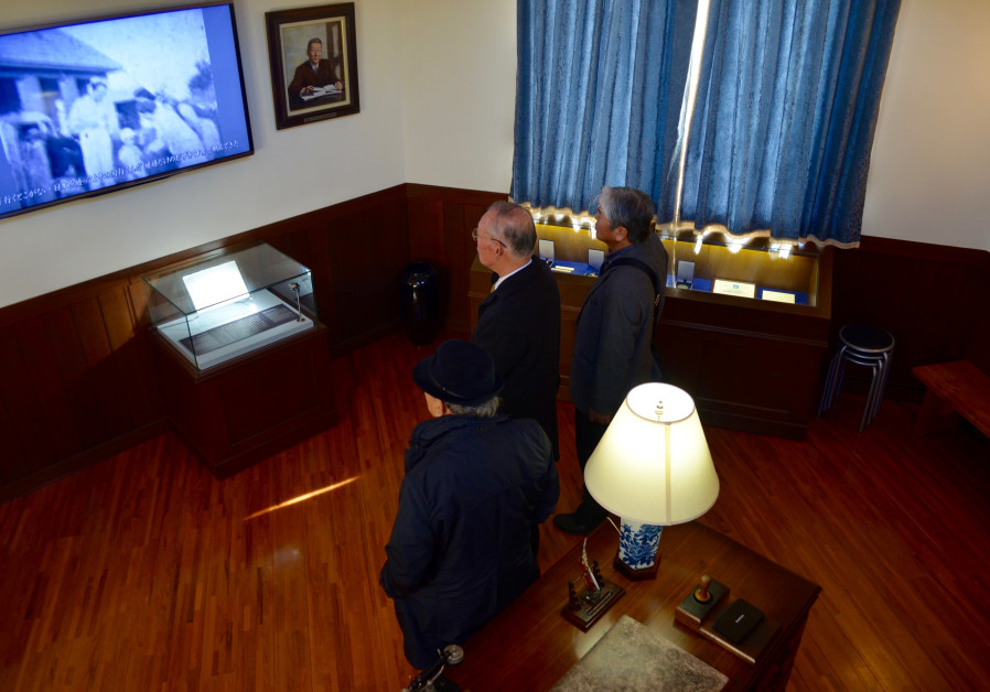 In Chiune Sugihara Memorial Hall in Yaotsu, Japan, locals watch a video documenting his actions in a replica of the diplomat's Kaunas office. (Michael Wilner, November 2017)