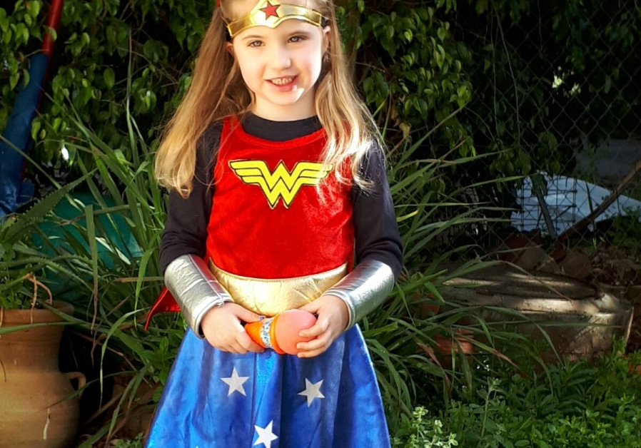 A young Israeli dressed as Wonder Woman for Purim (credit: Ron Friedman)