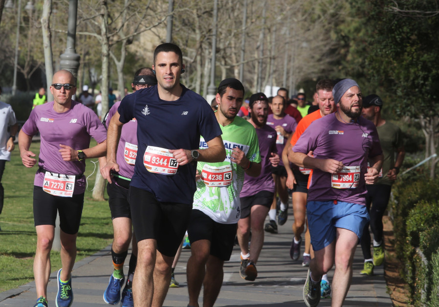 Runners participate in the Jerusalem Marathon, March 2018 (credit: Marc Israel Sellem)