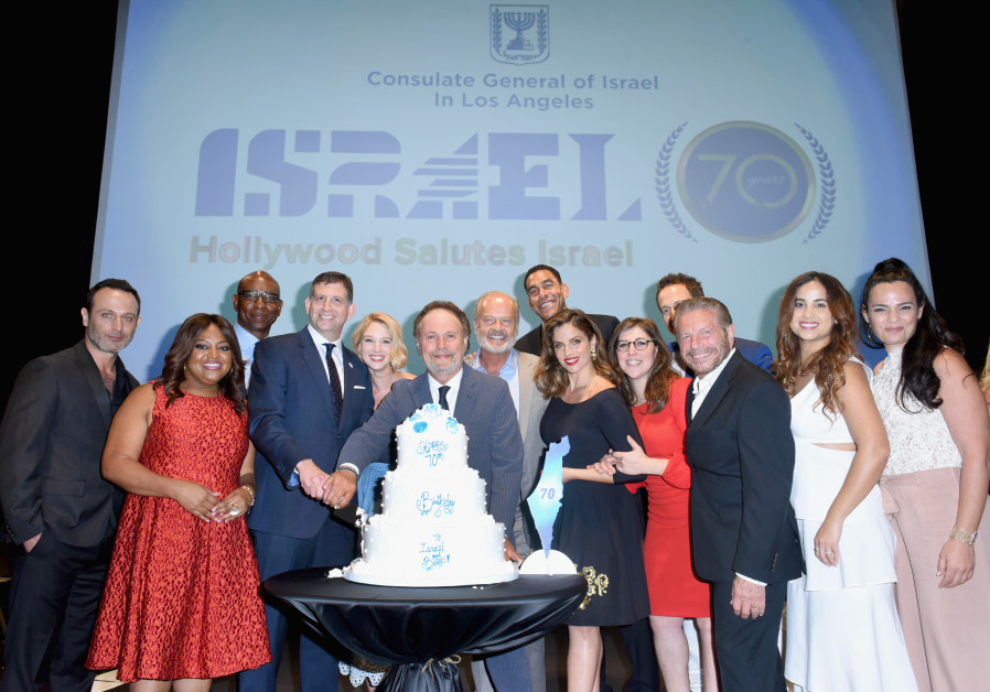 Billy Crystal, Mayim Bialik and Kelsey Grammer stand with attendees of the 'Hollywood Salutes Israel' event at Universal Studios in Hollywood on Sunday, June 10, 2018 (Credit: Israel Consulate In Los Angeles)