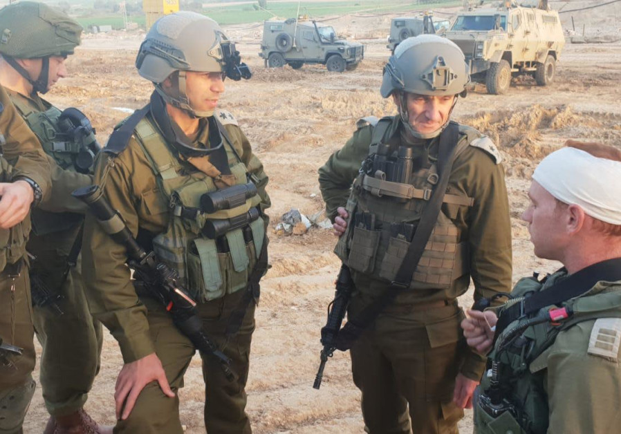 Head of IDF Southern Command, Maj.-Gen. Hertzi Halevy, meets an officer who was shot in the helmet by a Gazan sniper / IDF Spokesperson's Unit