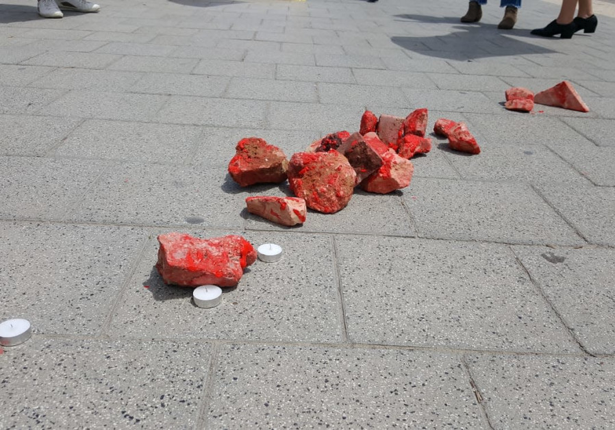 Rocks, painted in red, outside the IDF HQ in Tel Aviv during a protest against army anti-terror policy. Protesters wanted to show that stone-throwing can kill / Credit: Im Tirzu 