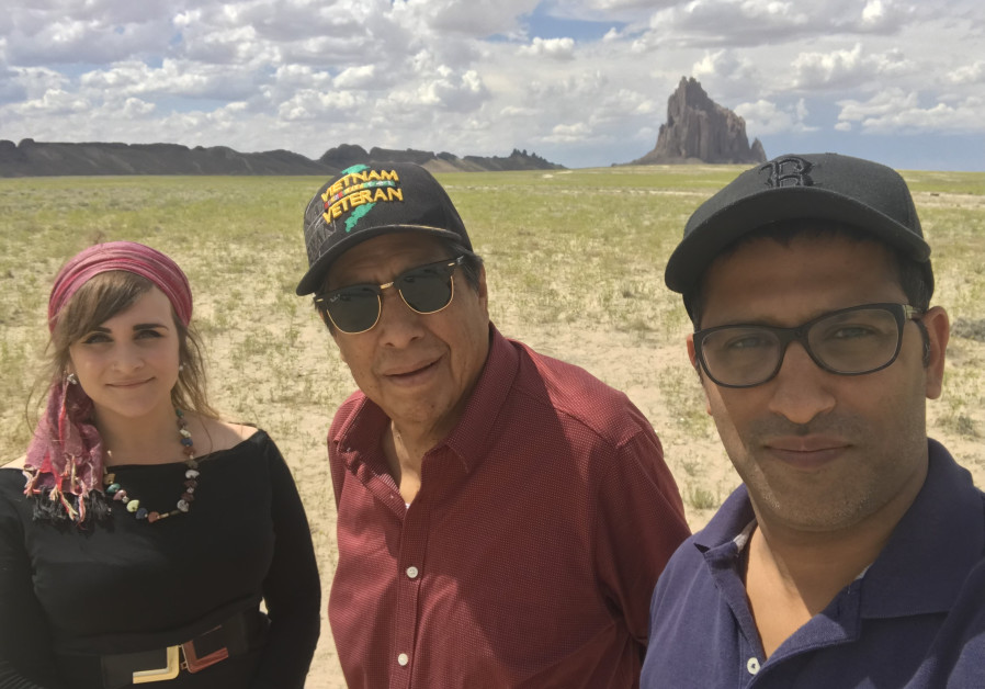 SHMUEL AND an Indigenous Bridges member pose with Pastor Robert Tso of the Navajo nation (center) in front of Shiprock, a site sacred to the Navajo who call it ‘Winged Rock.
