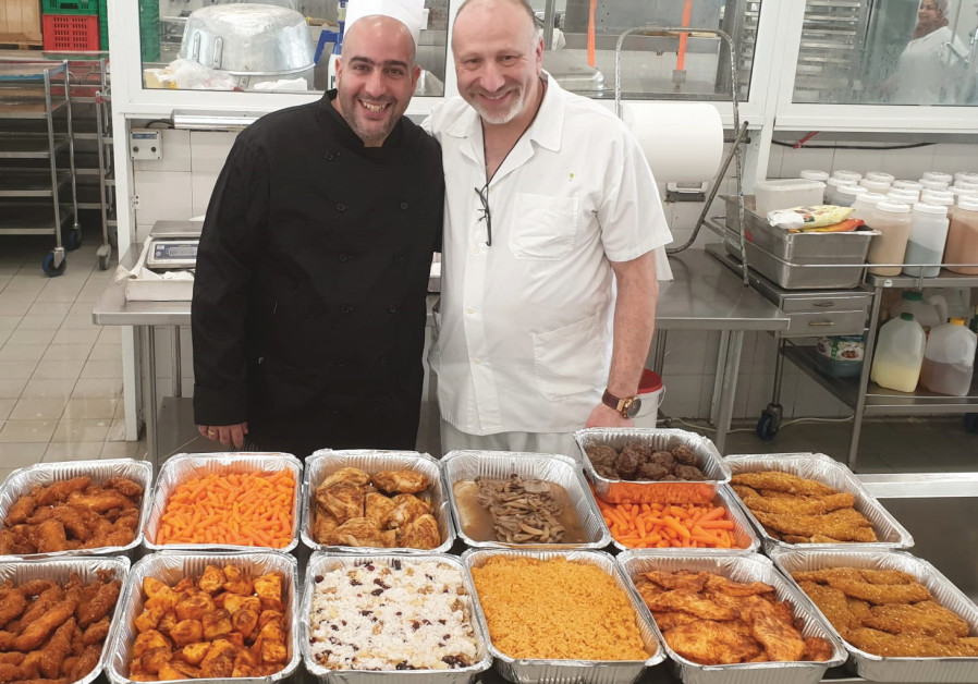 ALEXANDER GLOZMAN (right), head of food services, works with chef Liran Azuri to accommodate corona patients’ needs at Rabin Medical Center, Hasharon campus, in Petah Tikva. (Credit: Rabin Medical Center Spokesman)