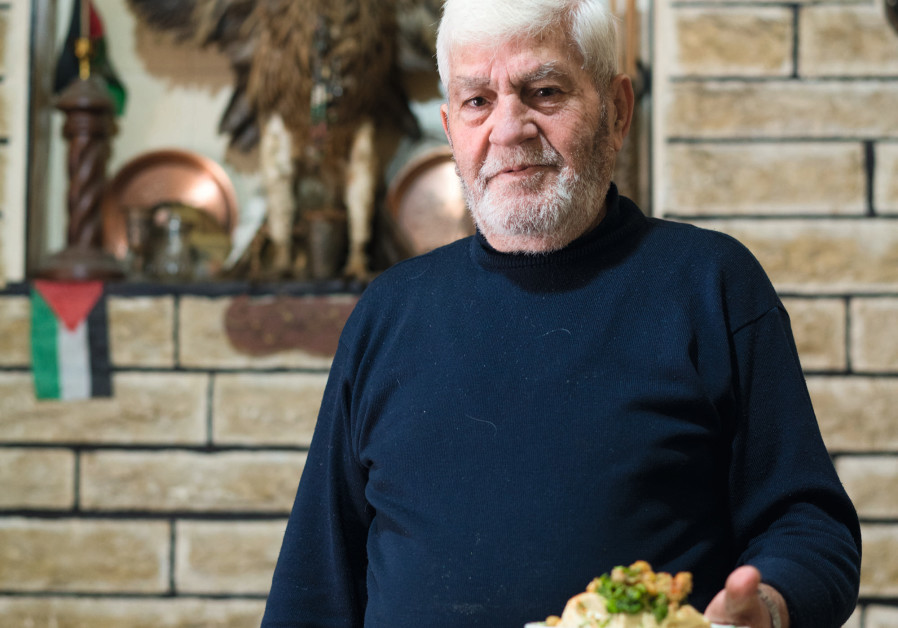 EAST JERUSALEM restaurateur Hassan alBaghdadi still uses a pestle and mortar to make his hummus. (Eilon Paz)