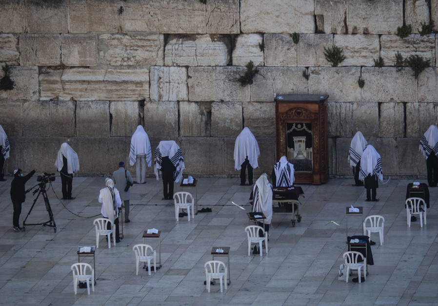 A small group of socially distanced kohens, or Jewish high priests, take part in Passover prayers by the Western Wall, April 12, 2020./ Ilia Yefimovich/picture alliance via Getty Images