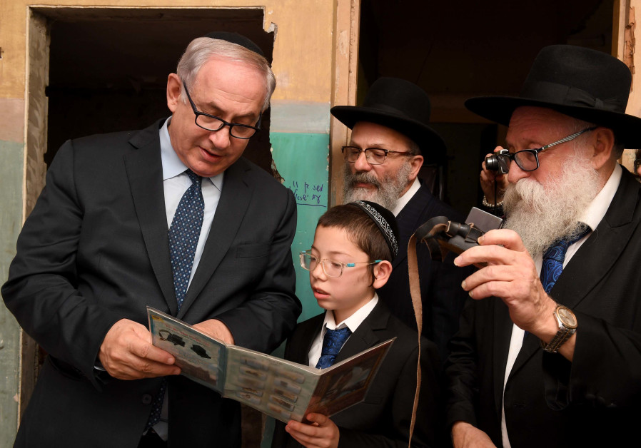 Prime Minister Benjamin Netanyahu and Moshe Holtzberg at the Chabad House in Mumbai on January 18th, 2018. (Credit: Avi Ohayon- GPO)