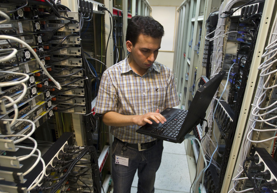 A computer engineer checks equipment at an internet service provider in Tehran February 15, 2011